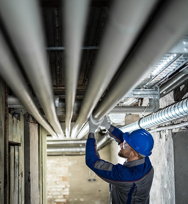 Repairing pipes inside construction site